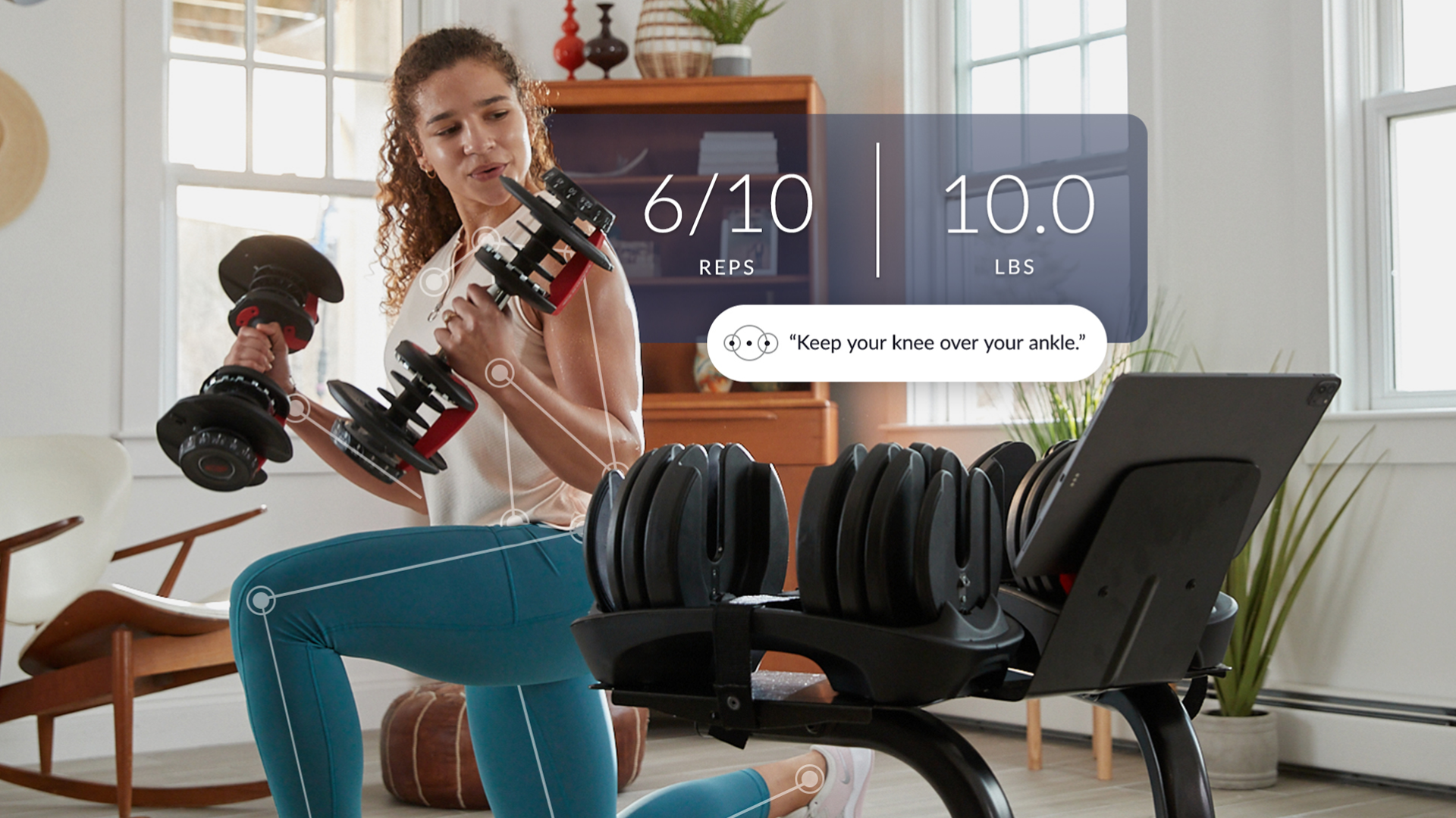 A woman holding Bowflex weights with an overlay of stats being counted by the Nautilus a JRNY app designed by Supply. The picture includes some text of the app telling the woman to "Keep your knee over your ankle"